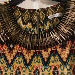 Ladies dress. Never worn. Multi color. 95% polyester 5% spandex